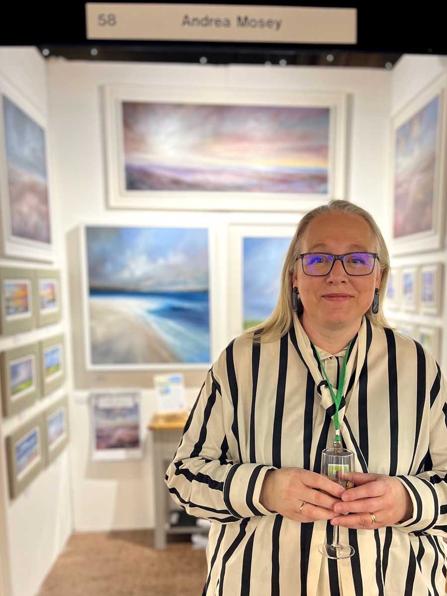 Andrea Mosey at an art fair with her work